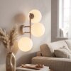 Modern globe wall light Gastor with three white glass shades for the couch