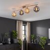 Modern Globe ceiling light Gastor with four smoke and amber glass shades on a curved bar