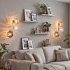 Modern globe wall light Koyoto, 2-piece set, three stacked glass shades, beside a mirror