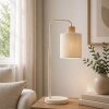 Brilliant Leuchten Table Lamp Arlo with a curved arm and beige fabric shade