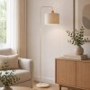 Brilliant Floor Lamp Arlo with a cylindrical beige fabric shade and wooden collar